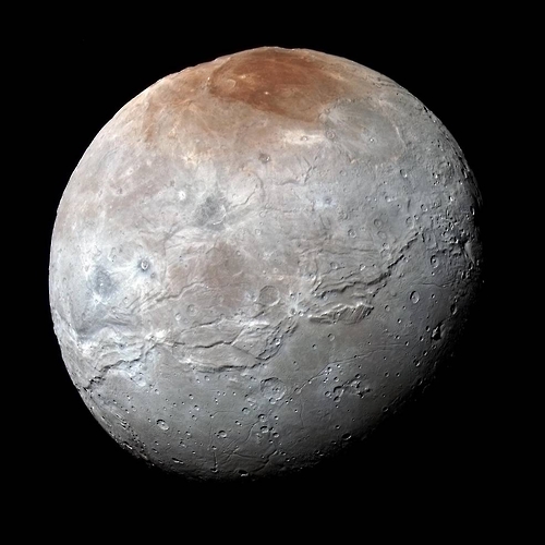 명왕성의 위성인 카론의 모습. 북극이 암적색이며 적도 근처에 거대한 계곡이 있다. [NASA/JHUAPL/SwRI 제공=연합뉴스]