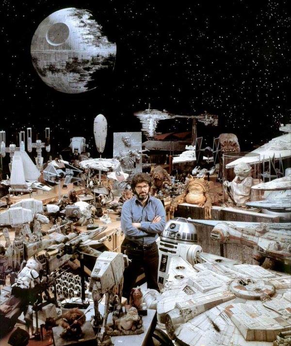 1983 George Lucas surrounded by Star Wars props.jpg