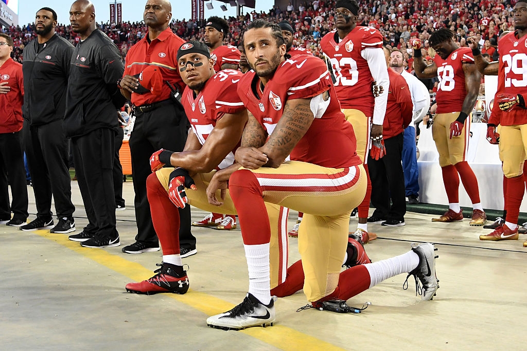 Colin Kaepernick kneeling during the national anthem