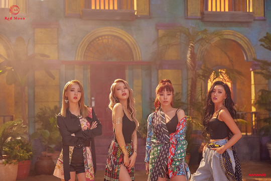 MAMAMOOs new song Youre Doing concept photo, which is about to come back on the 16th, was released.MAMAMOO released the concept photo of the title song You and the Year of its seventh mini album RED Moon through the official SNS at midnight today (10th), further raising expectations for a comeback.In the public photos, the chic and charismatic appearance of MAMAMOO captures the attention in the exotic background where the atmosphere of South America is felt.The chic black color costumes were mixed with colorful patchwork shirts, skirts, scarves, etc., and each member showed a different charm.Especially, it is noticeable with colorful visuals and confident poses that show passionate and healthy sexy charm like a hot sun in summer.Previously, MAMAMOO released a concept photo for each member of Hwasa, Moonbyul, Sola, and Wheein, followed by a complete concept photo featuring the atmosphere of the new song You and the Year, raising fans expectations for the new album.MAMAMOO, which is about to come back with RED Moon, a new mini album of Four Seasons Pocal, predicted an album with colorful and passionate charm.The title song You and the Year is a song like a cider that is always thinking about oneself, thinking about oneself, and giving a heartfelt step to a lover who takes care of himself first. It is expected to show the charm of the original girl Crush down properly.On the other hand, MAMAMOO will announce its seventh mini album RED Moon at 6 pm on the 16th and will start full-scale activities with the title song You Na Sea.