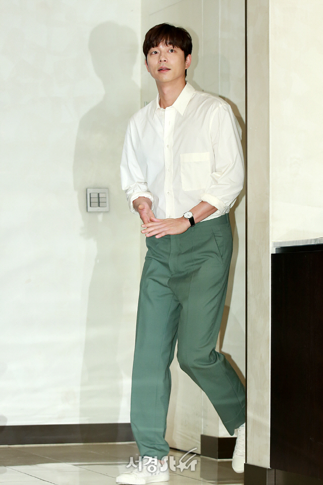 Actor Gong Yoo is entering to attend the photo call event.