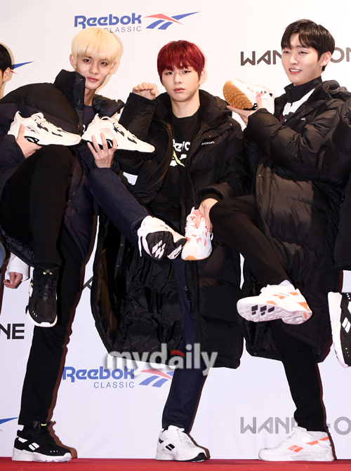 Group Wanna One Bae Jin Young, Kang Daniel, and Yoon Ji-sung (left) pose at a Sports Clothing brand photo event held at Sejong University Ocean Hall in Seoul on the afternoon of the 11th.The group Wanna One is preparing for a comeback with 111 = 1, which will be the first regular album and the last Wanna One activity on November 19th.