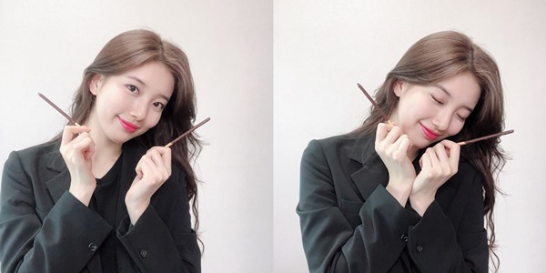 Singer and actor Bae Suzy has released a recent selfie on Pepero Day.Bae Suzy posted a picture on the official SNS on the 11th with an article entitled Suite One Bae Suzy One.In the open photo, Bae Suzy stares at the camera with a pepero; Bae Suzy has a warm charm with a watery blue beauty and a lovely smile.Bae Suzy is filming a new drama Vagabond with Lee Seung Gi.Vagabond is a work that depicts the process of a man involved in a civil harbor plane crash digging into a huge national corruption found in a concealed truth.