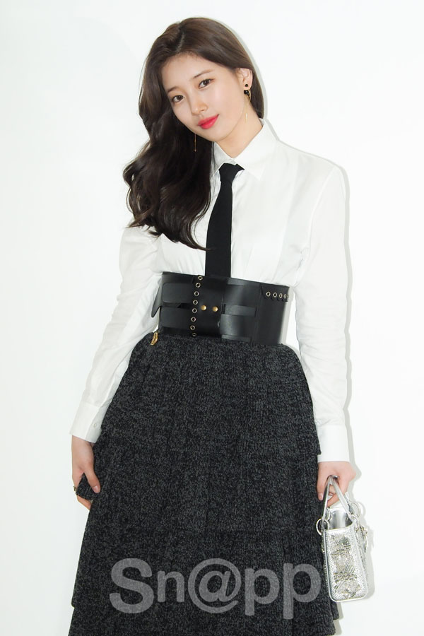 Actor Bae Suzy poses in the photo wall to commemorate the Dior Lady Art # 3 exhibition held at Cheongdam House of Dior in Gangnam-gu, Seoul on the afternoon of the 14th.On this day, Bae Suzy produced a sensual black and white look that matched a thick belt with thick wave hair and attracted the attention of reporters.Written by Park Ji-ae, a photo of a fashion webzine,Actor Bae Suzy poses in the photo wall to commemorate the Dior Lady Art # 3 exhibition held at Cheongdam House of Dior in Gangnam-gu, Seoul on the afternoon of the 14th.