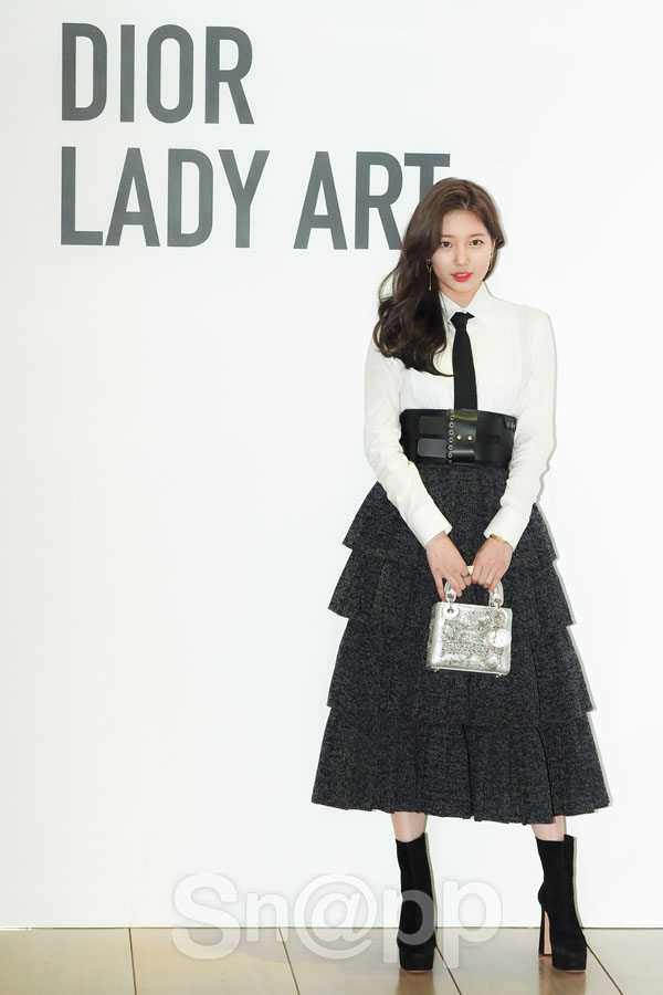 Actor Bae Suzy poses in the photo wall to commemorate the Dior Lady Art # 3 exhibition held at Cheongdam House of Dior in Gangnam-gu, Seoul on the afternoon of the 14th.On this day, Bae Suzy produced a sensual black and white look that matched a thick belt with thick wave hair and attracted the attention of reporters.Written by Park Ji-ae, a photo of a fashion webzine,Actor Bae Suzy poses in the photo wall to commemorate the Dior Lady Art # 3 exhibition held at Cheongdam House of Dior in Gangnam-gu, Seoul on the afternoon of the 14th.