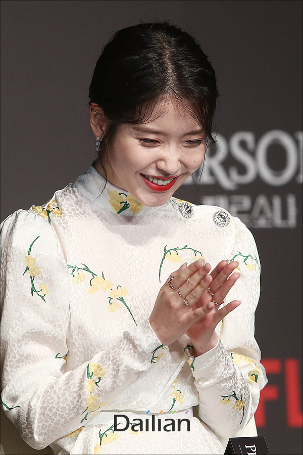 Singer and actor IU (Lee Ji-eun) laughs at the Netflix original series Persona production report held at the Conrad Hotel in Yeouido, Seoul on the morning of the 27th.