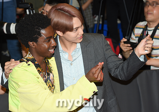 Actors Caleb McLaughlin and EXO Kai are posing on the red carpet of Netflixs popular original series Questionous Story 3 held at Time Square in Yeongdeungpo-gu, Seoul on the afternoon of the 20th.