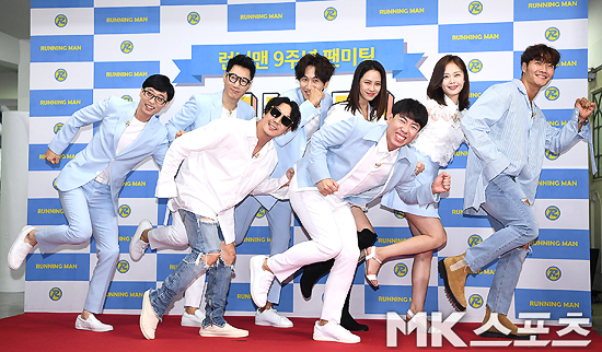 Running Man cast members pose at a fan meeting photo wall event commemorating the 9th anniversary of SBS entertainment Running Man held at the Seoul Seodaemun-GU Ewha Womans University Auditorium on the 26th.