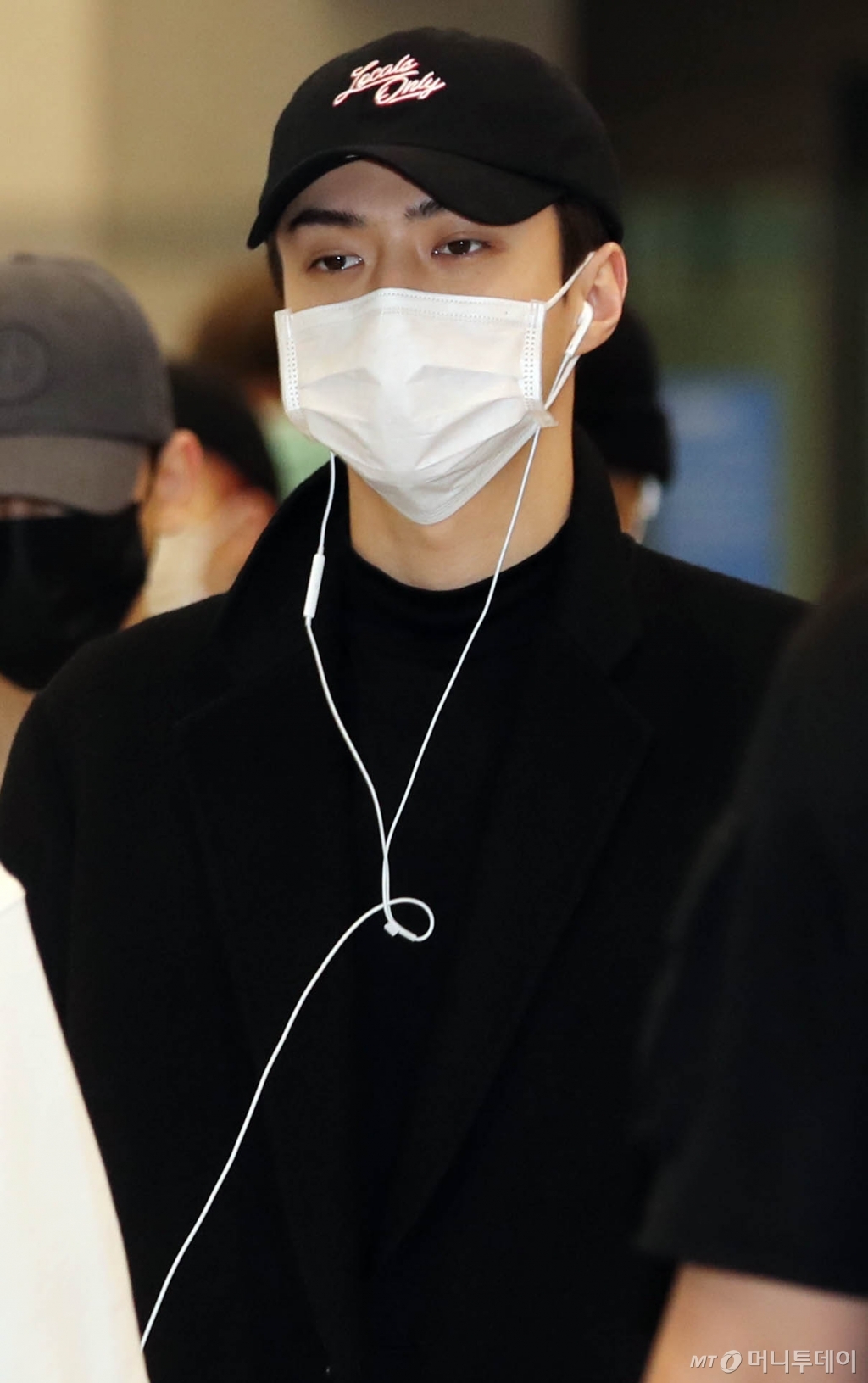 Group EXO Sehun arrives through the Incheon International Airport on Monday morning after a concert in Jakarta, Indonesia.
