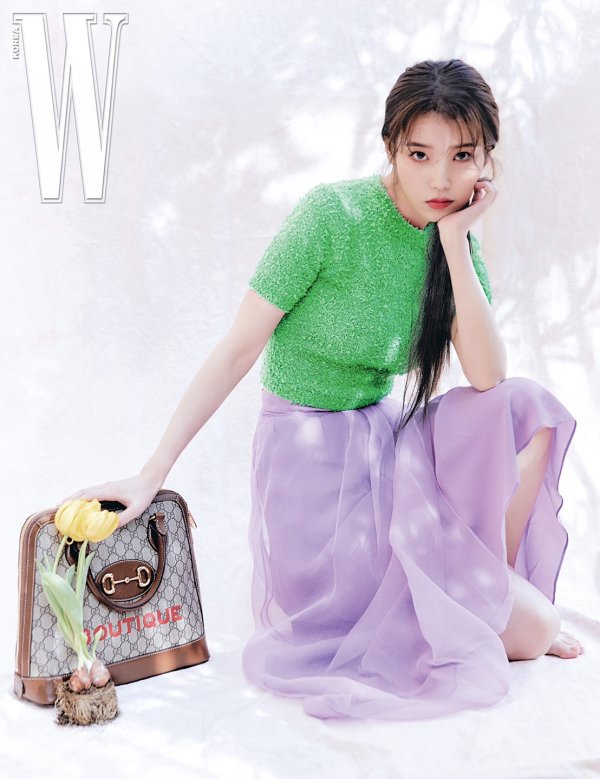 A fashion picture with Singer and Actor IU was released.IU, which decorated the cover of the April issue, completely digested various styles in fashion pictures with her delicate eyes and rich sensibility.IU in the picture shows a 2020 spring-summer collection look including a blue-silver color jacket, pants, a gold color silk shirt with G check printing, vintage wide pants, a greene color crook top and an asymmetrical lilac skirt.Here, the various designs of the bag with the gold tone of the hallsbit detail and the black leather mid-heel moccasin are matched to decorate the colorful and beautiful picture.All pictorial images and images are released on the W. Korea website.