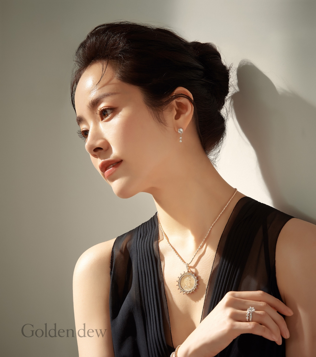 Actor Han Ji-min showed off his unique Elegance in the jewelery picture.The Fein jewelery brand Golden Dew released Wilhelmina Coin Jewelry and released a picture cut with the brand muse Han Ji Min on the 19th.Han Ji-min in the picture added a luxurious point to the deep V-neck costume with elegant wrinkles by matching the colorful Wilhelmina Coin Jewelry.Han Ji-min emphasized colorful jewelery by directing a natural bun hair that rolled up his head.In another pictorial, Han Ji-min wore a colorful COIN necklace with an elegant off-shoulder top that revealed a shoulder line.Han Ji-min showed off her elegant charm with a lovely ponytail hairstyle and subtle chic makeup.Wilhelmina Coin Jewelry, worn by Han Ji-min in the picture, is a heritage collection product that shows the 31-year tradition of Golden Dew, Koreas first Fein jewelery brand, which was born in 1989 by introducing COIN jewelery in Korea.Wilhelmina Coin Jewelry consisted of four pendants containing 10 guilder gold COINs (22K Gold COINs), which were actually used in the Netherlands until the early 20th century.It is a 22K yellow gold with elegant metal light on the gold COINs with the portrait of Queen Wilhelmina, adding a classic and profound style, and maximizing the splendor around the gold COIN with diamonds and rubies.With COIN jewelery as a global trend, we tried to express the Golden Dews female image that pursues the value of beauty with its own light and does not lose its dignity through COIN jewelery containing Queen Wilhelmina, one of the greatest women in 20th century Netherlands history, said Golden Dew.Meanwhile, Golden Dews Wilhelmina Coin Jewelry collection can be found at Golden Dew Cheongdam headquarters, Seoul Arts Center and department store stores nationwide.