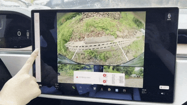 Instead of a shift lever, swipe up for drive, and swipe down for reverse or touch the P for park. [SARAH CHEA]