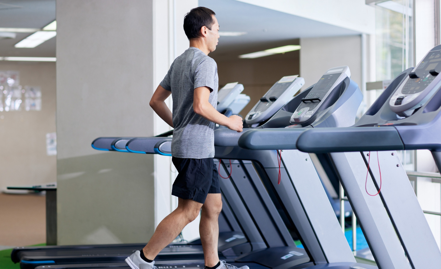 Man running on a treadmill with incline