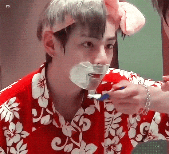 BTS member V shaves his beard in an undated video clip. [SCREEN CAPTURE]