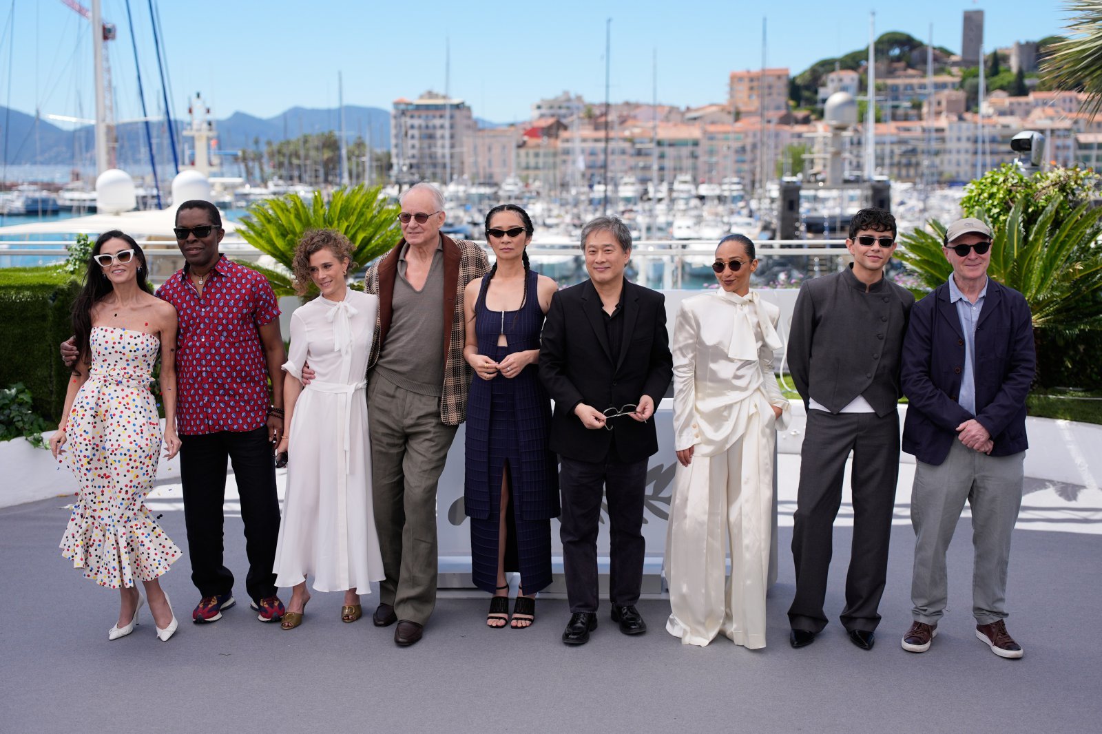 Jury president Park Chan-wook, sixth from left, poses with jury members Demi Moore, Isaach de Bankole, Laura Wandel, Stellan Skarsgard, Chloe Zhao, Ruth Negga, Diego Cespedes and Paul Laverty pose for photographers at the jury photo call at the 79th international film festival, Cannes, southern France, Tuesday, May 12, 2026. (AP Photo/John Locher)