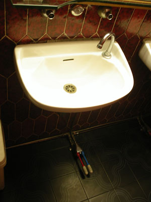 Toilet basin in Italy, with pedals for hot & cold water