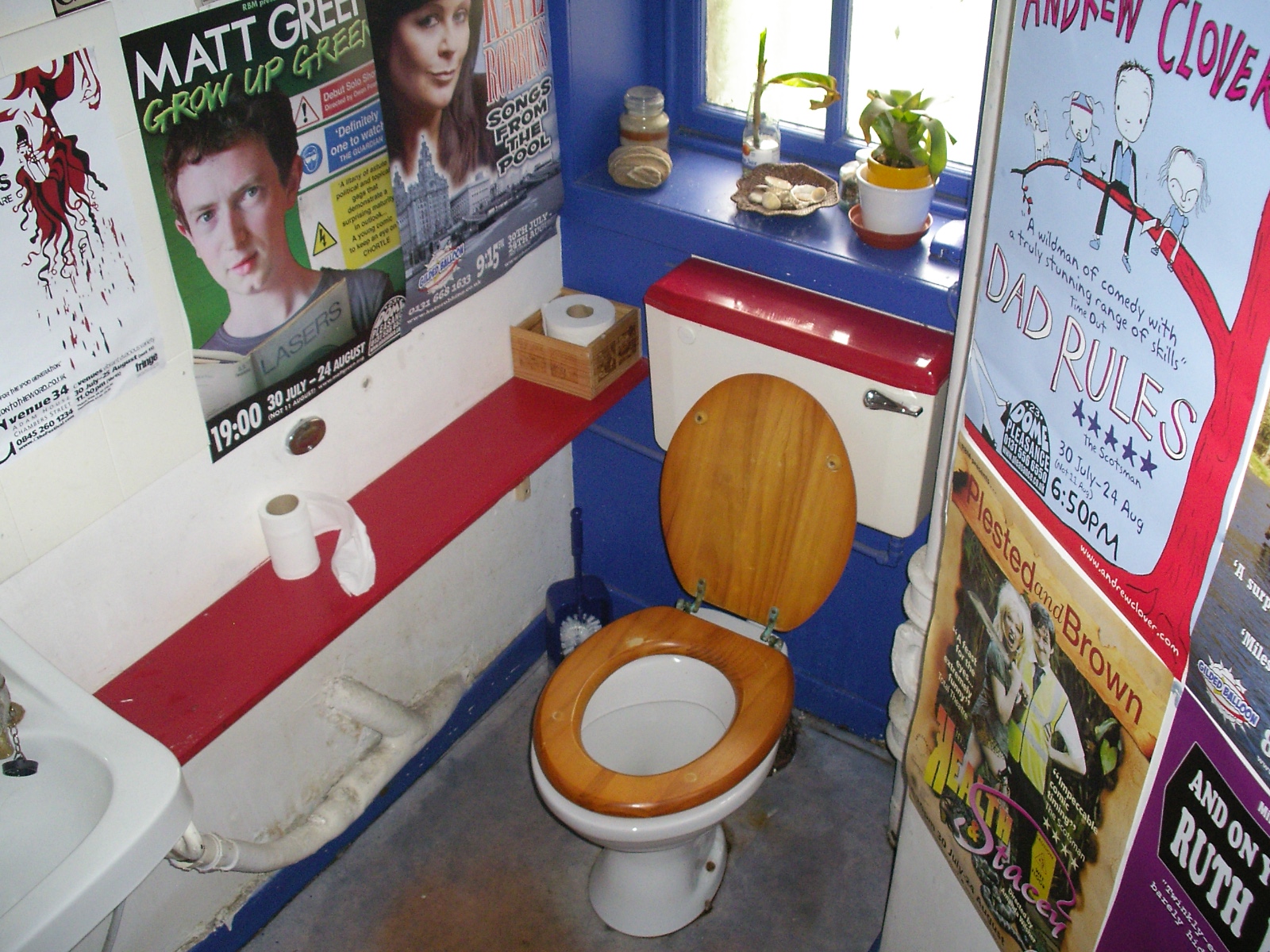 Restaurant Toilet Covered with Posters