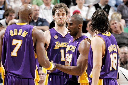 Kobe Bryant #24 of the Los Angeles Lakers regroups with his teammates Lamar Odom #7, Pau Gasol #16, and Sasha Vujacic #18 after drawing a foul against the Utah Jazz in Game Six of the Western Conference Semifinals.